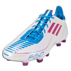 a white and blue soccer shoe with pink accents on the bottom part of the shoe