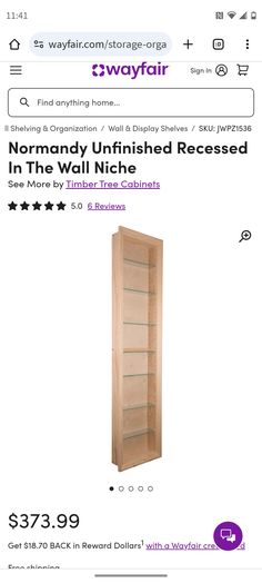 a wooden book shelf sitting on top of a storefront display window with the words normal unfinished unfinished furniture collection $ 379 99