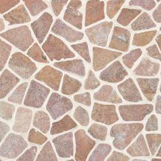 a close up view of a stone floor with different colors and shapes on the surface