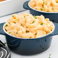 two bowls filled with macaroni and cheese