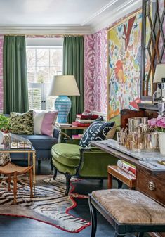 a living room filled with furniture and colorful walls