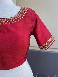 Boat Neck Style Maroon Color Raw Silk Blouse with beautiful Handwork Work done with beads. Item : Readymade BlouseColor : Maroon ColorBlouse Fabric : Raw Silk Lining : Yes, it is fully lined Padded or Non-Padded : PaddedClosure: Back Closure with hooks.Ready-to-Wear : YesDisclaimer - : -This is a Standard Size blouse. We do not guarantee perfect fit as every body and shape is different. Little or no alteration would be required to get the perfect fit. - Color variation is possible due to various Blouses For Sarees, Blouse Handwork, Pink Blouse Designs, Raw Silk Blouse, Maroon Saree, Beige Blouse, Blouse Designs Silk, Designer Evening Gowns, Readymade Blouse