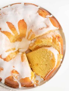 a bundt cake with white icing on a plate