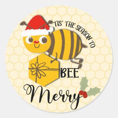 a christmas sticker with a bee holding a gift box and the words tis the season to bee merry