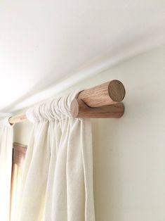 a curtain rod is hanging on the wall