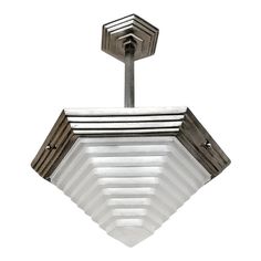 a square light fixture with an angled design on the top and bottom, against a white background