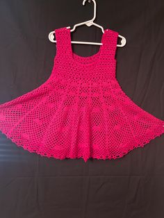 This handmade dress will fit a one year old girl. Hand crochet with an acrylic yarn and it can be machine wash and dry. The dress is about 21" long from shoulders. Handmade Cotton Crochet Dress, Pink Cotton Crochet Dress, Pink Sleeveless Cotton Crochet Dress, Baby Girls Dresses, Girl Hand, Crochet Doily Patterns, Handmade Dress, Crochet Doily, Doily Patterns