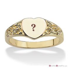 a heart shaped ring with a question mark on the front and bottom, set in 18k yellow gold