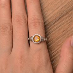 It is a natural citrine ring. The main stone is 7mm*7mm round cut, weight about 1.25 carats. To change the metal to a solid gold (white/rose) or platinum is also available, please ask for a quotation if you want. You can also go to my shop Home for more elegant rings: https://www.etsy.com/shop/godjewelry?ref=hdr_shop_menu citrine is November birthstone Customization is always welcome and please feel free to contact with me if you have any design ideas! Yellow Gemstone Ring, Engagement Ring Round Cut, Round Cut Ring, Citrine Ring Engagement, Elegant Rings, Engagement Ring Round, Yellow Gemstones, Round Cut Engagement Rings, Engagement Rings Round