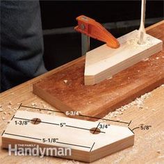 a piece of wood being sanded on top of a table with a planer