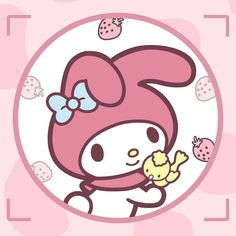 a hello kitty holding a piece of food with strawberries around her neck and wearing a bow