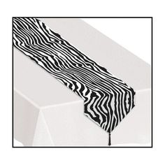 a black and white zebra print table runner