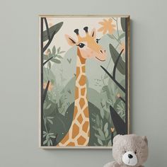 a teddy bear sitting next to a framed giraffe print on a gray wall