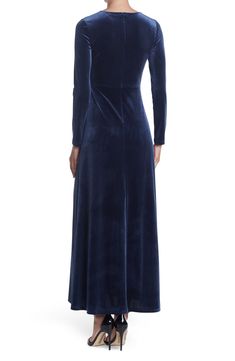 The Rosalie is a glamorous velvet maxi dress that's sure to turn covetous heads wherever you go. 57" length (size S) Surplice neck Long sleeves Back zip closure Lined Shell is 90% polyester, 10% spandex; lining is 100% polyester Machine wash, line dry Imported Model Stats: 5'10" height; 34" bust; 27" waist; 35" hips. Model is wearing size S. Fitted Velvet Maxi Dress For Night Out, Winter Evening Full Length Maxi Dress, Velvet Maxi Dress For Night Out, Fitted Velvet Maxi Dress For Evening, Winter Maxi Dress For Evening, Fitted Floor-length Velvet Cocktail Dress, Floor-length Velvet Dress For Night Out, Velvet Floor-length Night Out Dress, Velvet Floor-length Dress For Night Out