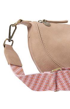 A soft woven strap adds a sporty finish to a half-moon crossbody bag with a surprisingly spacious interior. 11"W x 7"H x 2"D 13-28" strap drop Top zip closure Optional crossbody strap Imported Casual Logo Strap For Crossbody Bag, Casual Bags With Logo Strap, Casual Leather Bag With Logo Strap, Pink Everyday Bag With Logo Strap, Casual Everyday Bag With Logo Strap, Casual Travel Bags With Logo Strap, Pink Bags With Logo Strap For Everyday, Brushed Brass Hardware, Drop Top