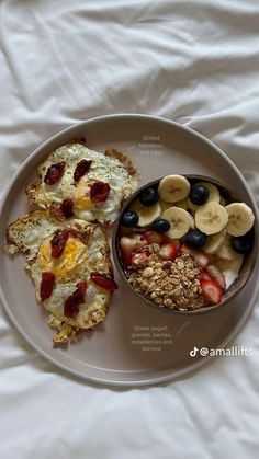 a white plate topped with fruit and muffins next to a bowl of cereal