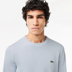 This sweater is the fruit of 90 years of Lacoste knitwear expertise. An essential, pared-back design, featuring a classic crew neck. Made from premium cotton jersey, it offers the perfect blend of elegance and sporting style. Classic Blue Crew Neck Sweatshirt, Fine Knit Cotton Crew Neck Sweater, Classic Crew Neck Sweater, Classic Sweatshirt With Ribbed Crew Neckline, Classic Crew Top With Ribbed Collar, Classic Crew Neck Sweater With Ribbed Neckline, Classic Sweater With Ribbed Crew Neck, Classic Cotton Crew Neck Sweater, Classic Solid Crew Neck Sweatshirt