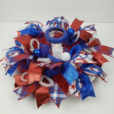 a red, white and blue hair bow with two rings on it's side