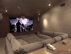 a living room filled with furniture and a flat screen tv mounted to the side of a wall