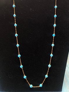 Add A Touch Of Western Style To Any Outfit With This Beautiful Turquoise Necklace! Turquoise Beads Gold Colored Chain Claw Closure Turquoise Necklace With Lobster Clasp For Jewelry Making, Turquoise Necklace With Lobster Clasp And Round Beads, Turquoise Beaded Chain Long Necklace, Turquoise Long Necklace With Beaded Chain, Light Blue Beaded Chain Jewelry Gift, Light Blue Single Strand Jewelry For Jewelry Making, Blue Beaded Chain Turquoise Necklace As Gift, Adjustable Blue Beaded Turquoise Necklace, Turquoise Long Beaded Chain Necklace