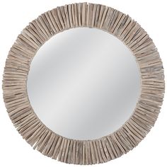 a round mirror made out of wood sticks