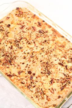 a casserole dish with pecans and raisins in it