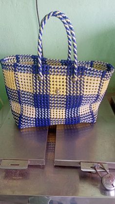 a blue and white basket sitting on top of a table