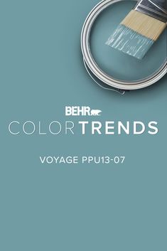 a paint can with a brush in it and the words behr colortrends above it