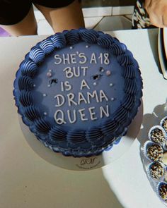 there is a cake that says she's a but is a drama queen on it