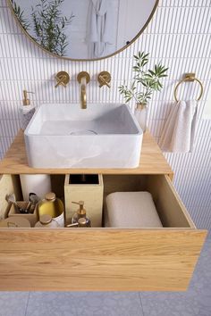 a bathroom with a sink and mirror in it