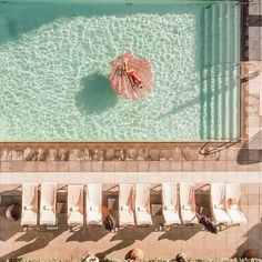 an aerial view of the pool and lounge chairs