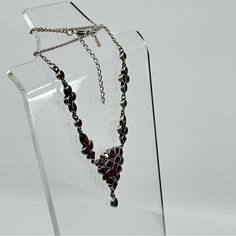 Step Into A Realm Of Timeless Elegance With This Rare Vintage Choker Necklace. Spanning 17 Inches In Length And Hand Crafted From Sterling Silver, It Showcases The Natural, Untreated Beauty Of Garnet Gemstones - Rare Rich Red Burgundy Color. The Central Feature Is A Captivating Cluster Design, Which You Can Admire In The Image Provided. This Piece Offers Versatility With An Adjustable Length, Allowing For Up To 2 Inches Of Extension To Ensure The Perfect Fit. Stamped With ‘925’ To Signify Its Quality, This Necklace Is A Stunning Find For Collectors And Fashion Enthusiasts Alike. Add This Unique Garnet Gemstone Choker To Your Collection - Buy On Live Or Make An Offer Vintage Choker Necklace, Chocker Necklace, Gemstone Choker, Vintage Choker, Burgundy Color, Garnet Gemstone, Burgundy Red, Womens Jewelry Necklace, Garnet