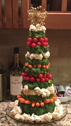 a christmas tree made out of broccoli, cauliflower and carrots