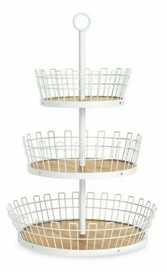 three tiered white metal basket holder