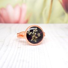 I used a tiny Queen Anne's lace and skeleton leaf to create the setting. Flowers are preserved in resin and will not fade, or change colour. The setting measures approximately 11 mm in diameter. The ring is made of brass (rose-gold plated), and is adjustable in size (from size M (US size 6) up to size Q (US size 8)). Please note that my flower pieces are one of a kind items, due to each flower, leaf or petal being slightly different. The item you receive will be the one from the photos. The colo Nature-inspired Rose Gold Flower Ring As Gift, Adjustable Rings With Pressed Flowers, Handmade Rose Gold Flower Ring, Adjustable Resin Jewelry With Pressed Flowers, Real Flower Ring, Real Flower Jewellery, Suntan Lotion, Real Flower Jewelry, Resin Jewellery