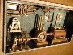 the inside of a box with pipes and valves on it's sides is shown