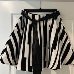 Black And White Flare Skirt With Pockets And Zips Fron The Back With Attatched Pleather Belt Tie. Chic Striped Mini Skirt With Lining, Chic Black And White Skirt For Spring, Chic Fitted Black And White Skirt, White Flares, Belt Tie, Skirt With Pockets, Belt Tying, Skirts With Pockets, Flare Skirt