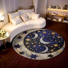 a living room filled with white furniture and stars on the rug in front of a couch