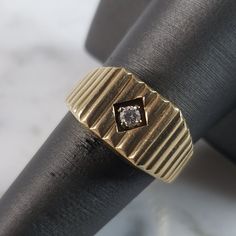 A Mens Vintage Estate 14k Yellow Gold Modernist Diamond Ring With .10cts Of Diamonds. The Ring Weighs 6.9g. The Size Of The Ring Is A 8.25. Ring Is Marked On The Inside Of The Band. This Makes A Lovely Gift For That Someone Special. Any Questions, Please Do Not Hesitate To Ask. Be Sure To Check Out Some Of My Other Great Items Up For Sale. Thank You. Modern Diamond Signet Ring Stamped 14k, Formal Wide Band Diamond Ring With Single Diamond, Formal Diamond Cut Diamond Signet Ring, Formal Diamond Cut Signet Ring, Classic Wide Band Jewelry With Single Diamond, Classic Vs Clarity Signet Ring For Formal Occasions, Timeless 14k Stamped Diamond Ring For Formal Occasions, Formal 14k Gold Diamond Ring Stamped 14k, Diamond Cut Signet Ring For Formal Occasions