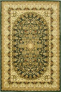 a green and beige rug with an ornate design on the center, surrounded by gold trimming