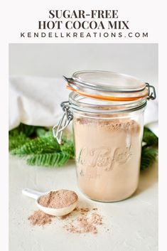 a jar filled with sugar next to a spoon