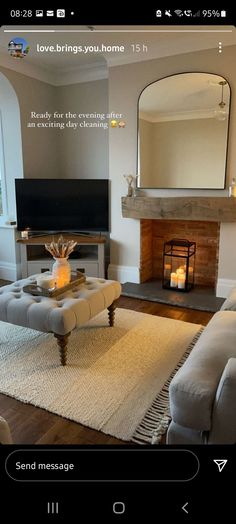 a living room filled with furniture and a fire place in front of a tv mounted on a wall