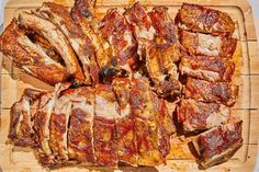 sliced meat sitting on top of a wooden cutting board