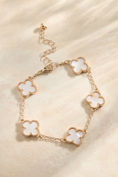 Carry a touch of style with the bracelet, a delightful fusion of charm and elegance. This double-sided bracelet features delicate clover details, adding a touch of playful charm to your everyday look. Can Cleef Bracelet White, Dior Clover Bracelet, Lucky Clover Bracelet, Kendra Scott Bracelet Clover, Van Cleef Clover Bracelet, Gold Clover Bracelet, Evry Jewels Bracelet, Julery Aesthetic, Cute Jewelry Gold