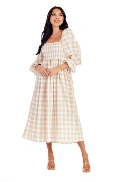 The Byerly Plaid Midi Dress offers women a stylish and comfortable choice. Crafted from a poly blend fabric, this dress showcases a timeless gingham pattern. The smocked chest adds a flattering and feminine touch, while the 3/4 sleeves with ruffle detail bring a playful and trendy vibe. With a length of approximately 48" from shoulder to hem, this midi dress is suitable for any occasion. It is easy to maintain, as it can be machine washed cold separately. For best results, use the gentle cycle a Gingham Midi Dress, Kids Candles, Gingham Pattern, Hand Crafted Furniture, Gingham Print, Gingham Dress, Bottom Clothes, Door Wreath Hanger, Clothes Gift