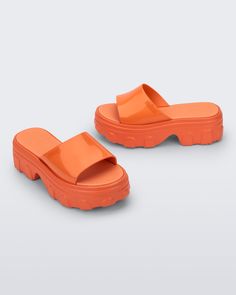 An edgy take on your traditional platform, the Ella Slide brings inspiration from the fisherman-style sandal designed for those who embrace their unique style. With a treaded heel, wide strap, and EVA insole, comfort is top of mind, but being fashionable is always number one. Summer Sport Sandals With Platform And Open Heel, Platform Sport Sandals With Open Heel For Summer, Modern Platform Jelly Sandals In Synthetic, Modern Platform Jelly Sandals, Trendy Jelly Sandals With Rubber Sole For Summer, Modern Platform Jelly Sandals In Synthetic Material, Trendy Summer Jelly Sandals With Rubber Sole, Modern Platform Jelly Sandals With Round Toe, Modern Synthetic Platform Jelly Sandals