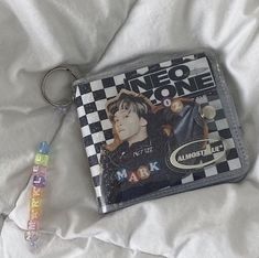 a keychain that is laying on top of a bed