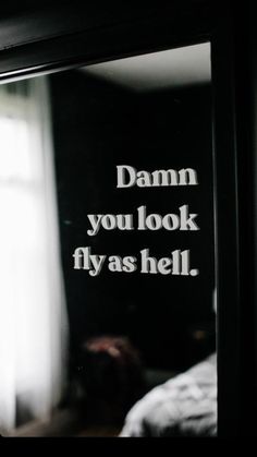 a mirror with the words damn you look flyas hell