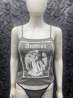 This is a gray Anthrax crop tank top with spaghetti straps. This has a Anthrax image screen printed on the front. 57% cotton/ 38% polyester/ 5% Spandex These are handmade screenprinted and slightly vary from the photo. Please feel free to email me any questions. Thanks for looking. Due to an influx of incorrect addresses if a package is returned, you must pay the shipping cost to resend the item to you. The seller is not responsible for any lost or stolen packages. Gothic Summer Camisole Top, Gothic Style Camisole Tops For Summer, Summer Gothic Camisole Tops, Summer Band Merch Crop Top, Gothic Tank Top For Halloween Concert, Gothic Halloween Tank Top For Concerts, Gray Tank Top For Summer Streetwear, Gothic Tank Top For Summer Concerts, Gray Cotton Punk Style Top