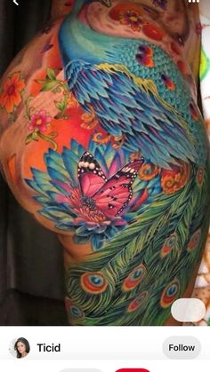 the back of a woman's stomach with colorful tattoos on it and an image of a